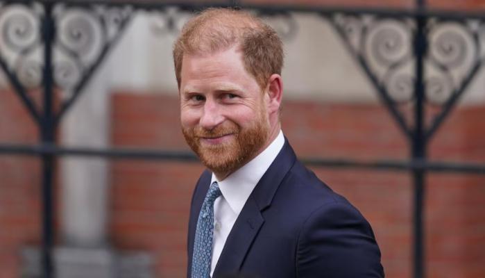 Prince Harry appears confident in first photos from airport