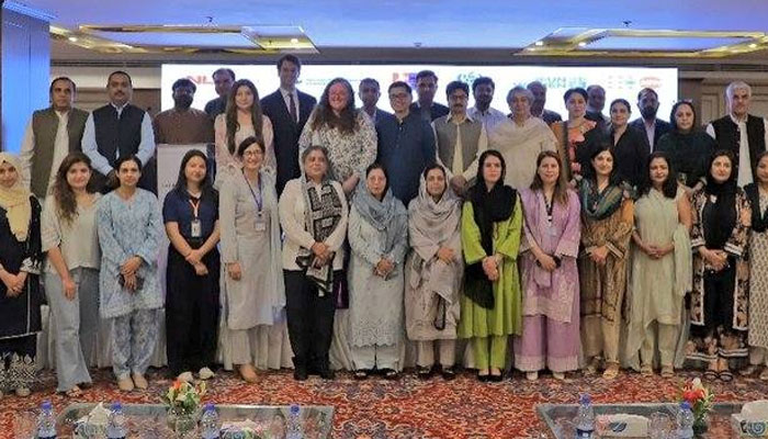 The image shows a group photo after teh conclusion of the first day of the two-day event organised by National Commission on the Status of Women (NCSW). — Facebook@ncswpk/File