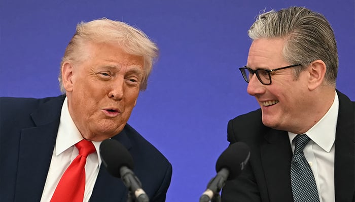 Britains Prime Minister Keir Starmer (R) and US President Donald Trump (L) laugh together as Trump speaks at the start of a Business event where the two leaders announce technology and business deals at Chequers, in Aylesbury, central England, on September 18, 2025, on the second day of the US Presidents second State Visit. — AFP
