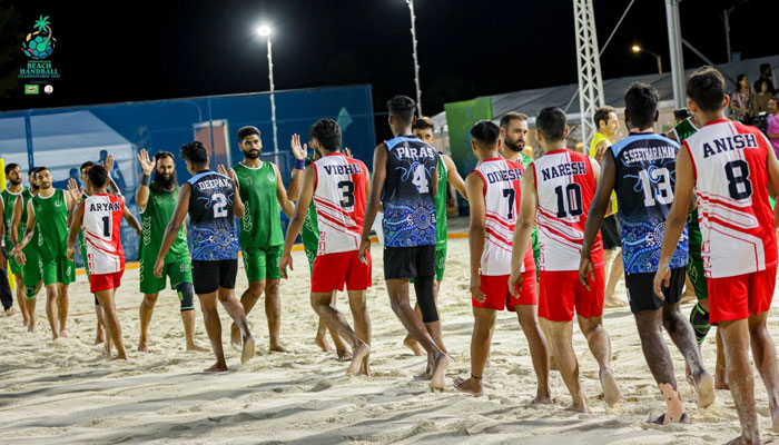 Pakistani and Indian players shake their hand after closing the match at the Khedhufushi City Beach Handball Court, on September 18, 2025. - Reporter