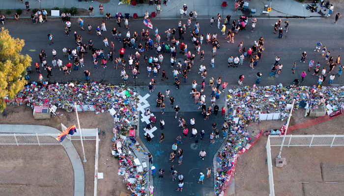 A drone view shows people gathering to pay tribute to slain conservative commentator Charlie Kirk at the headquarters of Turning Point USA, ahead of a memorial service for him which is to be held on September 21, in Phoenix, Arizona, US, September 20, 2025. — Reuters