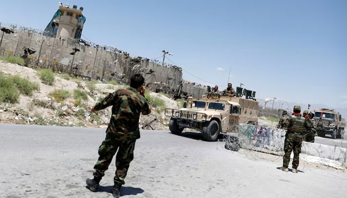 Afghan soldiers stand guard at a checkpoint outside the US Bagram air base, on the day the last of American troops vacated it, Parwan province, Afghanistan July 2, 2021. — Reuters