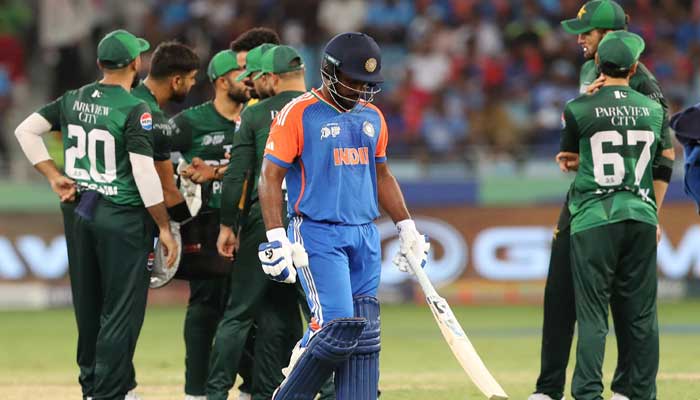 Indias Sanju Samson walks after being bowled out by Pakistans Haris Rauf  in Asia Cup match at Dubai International Cricket Stadium, Dubai, UAE, September 21, 2025. – Reuters