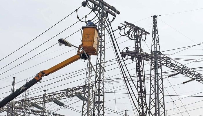 The representational image shows a worker of WAPDA busy in repairing high voltage electric wires at Shadman grid station in Lahore on February 19, 2023. — Online