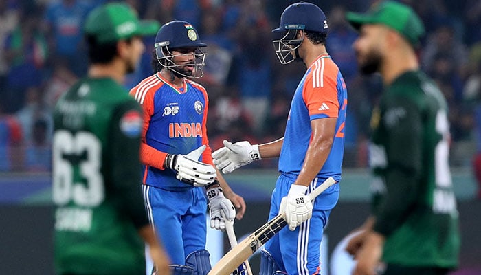 Indias Tilak Varma celebrates after reaching his half century with Shivam Dube. - Reuters