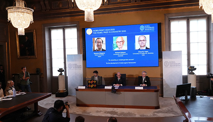 A screen displays the 2025 Nobel Prize laureates in Chemistry, Susumu Kitagawa (Kyoto University, Japan), Richard Robson (University of Melbourne, Australia), and Omar M. Yaghi (University of California, Berkeley, U.S.), as they are announced during a press conference at the Royal Swedish Academy of Sciences in Stockholm, Sweden October 8, 2025. — Reuters