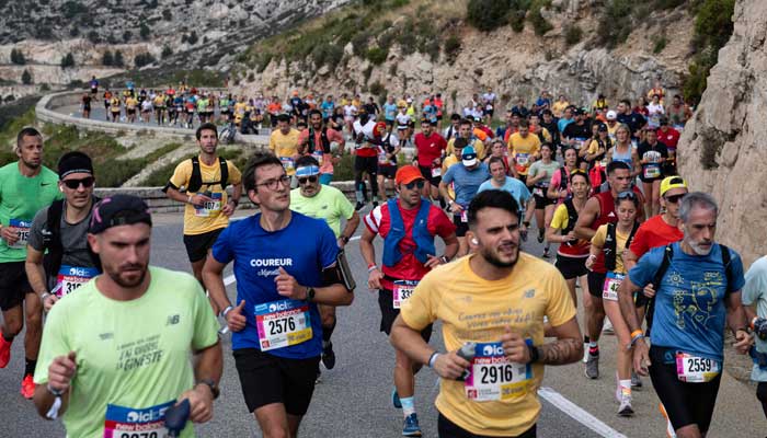 Athletes take part in the Marseille-Cassis Classique Internationale, a 20km half marathon race, in Marseille on October 26, 2025. - AFP