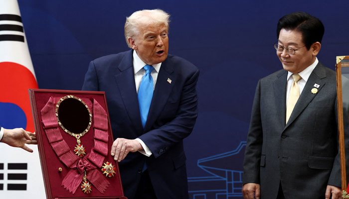 US President Donald Trump is presented with the Grand Order of Mugunghwa during a meeting with South Korean President Lee Jae Myung on the sidelines of the Asia-Pacific Economic Cooperation (APEC) leaders summit in Gyeongju, South Korea, October 29, 2025. — Reuters