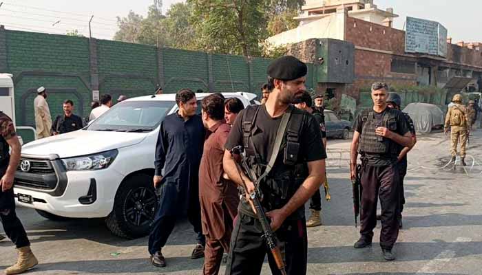 Policemen guard outside the CTD police station in Peshawar on November 2, 2025. — Reporter