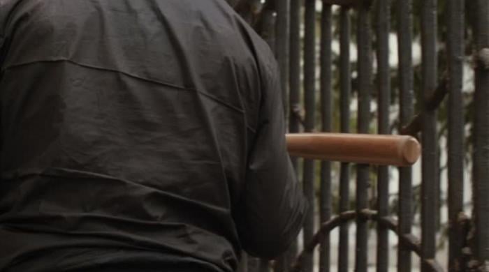 Injured by bullets, New York father-son duo beat alleged gunman with a bat