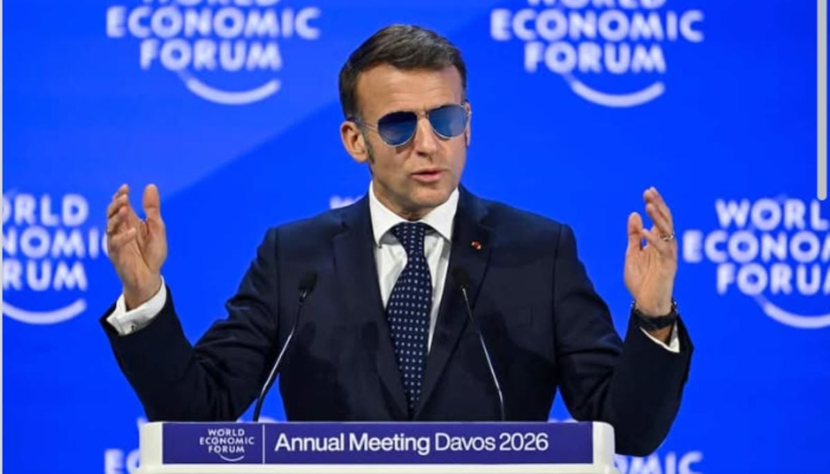 The French leader was seen wearing a striking pair of blue reflective aviator sunglasses while addressing world leaders at the World Economic Forum