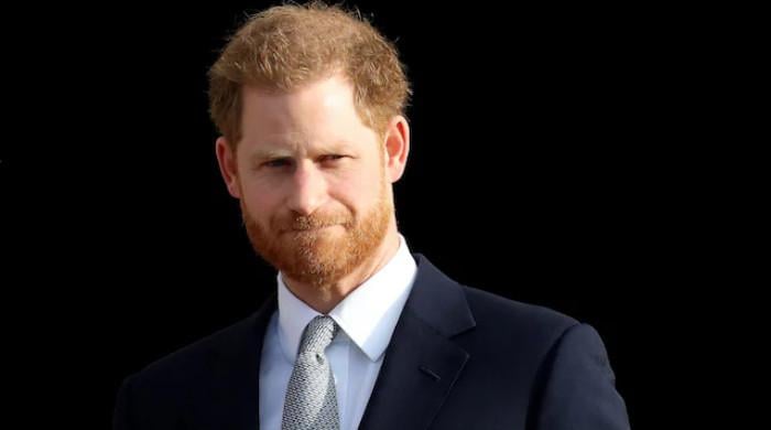 Prince Harry remains firm during London moment: watch