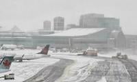 Toronto Pearson airport cancellations spike as snowstorm hits YYZ and YTZ