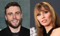 Gus Kenworthy likens Miley Cyrus rumors to THIS 'Heated Rivalry' arc