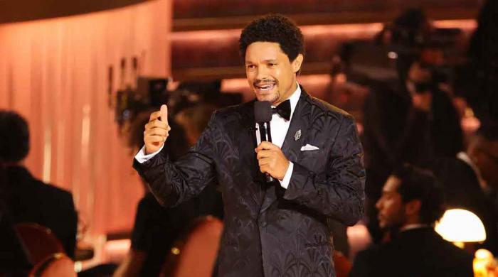 Chrissy Teigen shown deleted tweets as she laughs at Trevor Noah's Grammy jokes