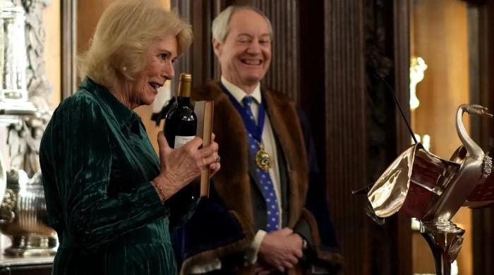 Queen Camilla steps away from Charles to explore family heirloom