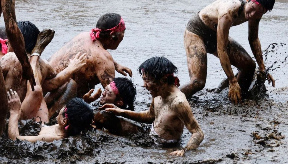 Participants in loincloths were seen wrestling in a mud field during Warabi Hadaka Matsuri, Warabi half-naked festival, in Yotsukaido, Chiba Prefecture, Japan, on February 25, 2026.