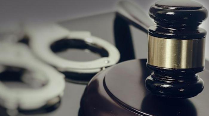 Woman jailed for sleeping next to husband's corpse for weeks