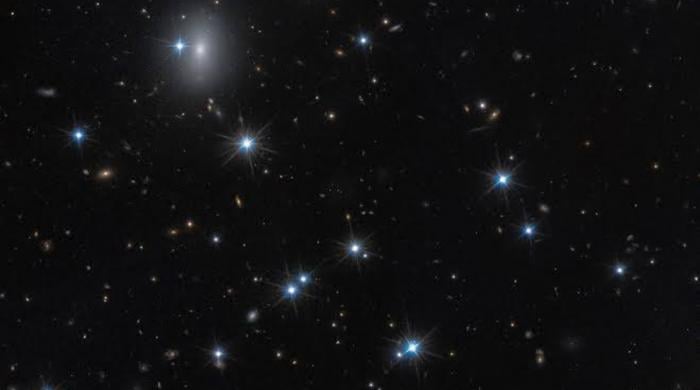 Astronomers spot nearly invisible galaxy packed with dark matter