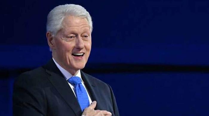 'He was really reminiscing': Clinton sparks reactions after being caught smiling at Epstein photos