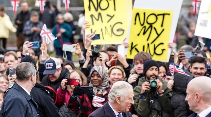 King Charles walks by as protestors cry: 'What did you know about Andrew?'  