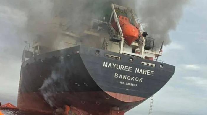 Cargo ship catches fire after three vessels struck by ‘unknown projectiles’ near Strait of Hormuz