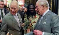 With a drink in hand, King Charles looks happy at palace event 