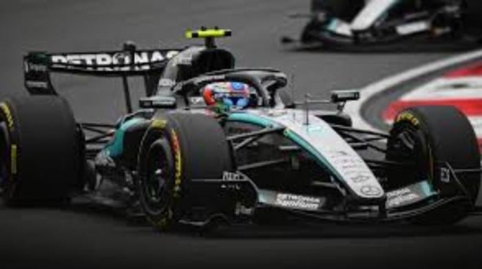  Lewis Hamilton takes the lead during eventful opening lap in China