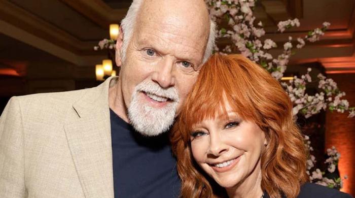 Reba McEntire puts marriage plans with Rex Linn on hold