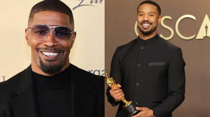 Jamie Foxx applauds Michael B. Jordan after his first Academy Award victory