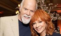 Reba McEntire puts marriage plans with Rex Linn on hold