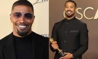 Jamie Foxx applauds Michael B. Jordan after his first Academy Award victory