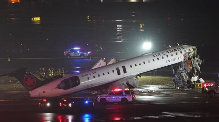 Two pilots dead after Air Canada plane crashes into fire truck at LaGuardia Airport 