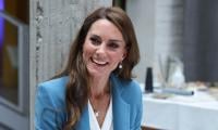 Day 2: Kate Middleton shows off her Italian alongside school kids in Italy