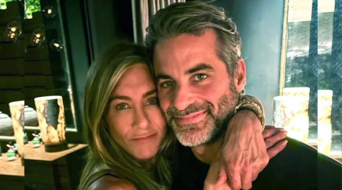 Jennifer Aniston shares loved-up moment with beau Jim Curtis