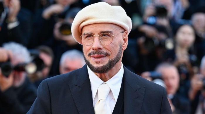 John Travolta admits to feeling 'wonderful' wearing berets