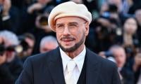 John Travolta admits to feeling 'wonderful' wearing berets