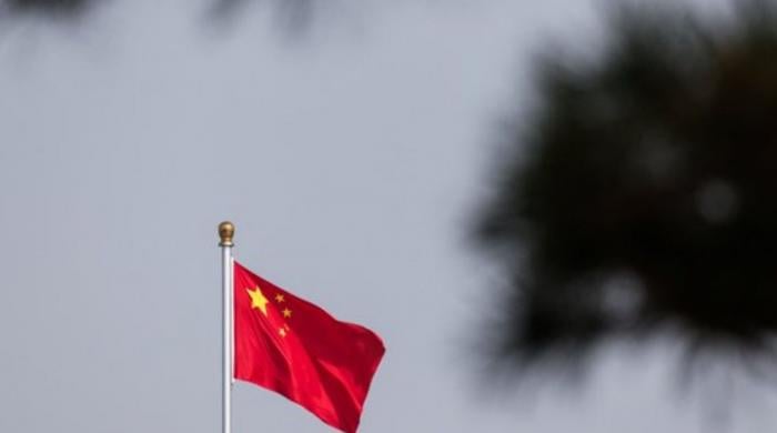 China tightens rules on overseas investment as tech rivalry with US intensifies