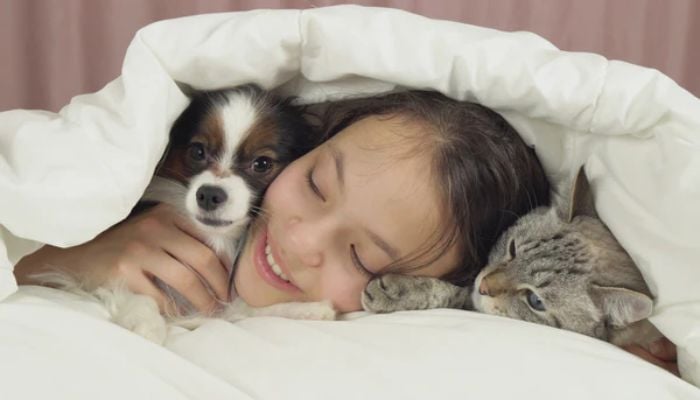 Is sleeping with your cat or dog bad for you? Here’s what study says