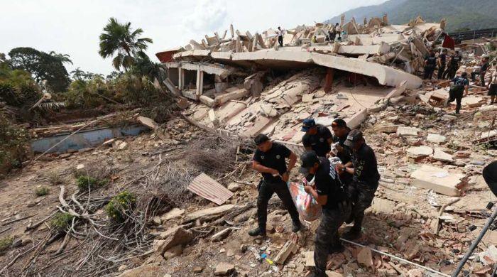 Father, son pulled alive from rubble four days after Venezuela quakes