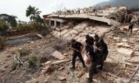 Father, son pulled alive from rubble four days after Venezuela quakes