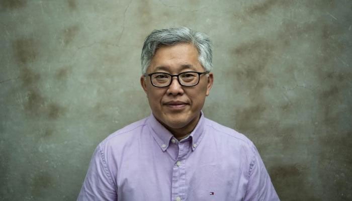 Pastor Ezra Jin, founder of Zion Church freed after prison, reunites with family in the US