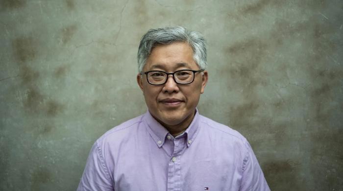 Pastor Ezra Jin, founder of Zion Church freed after prison, reunites with family in the US