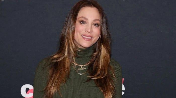 Big Bang Theory star Kaley Cuoco cradles baby bump in unseen snaps​