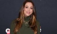 Big Bang Theory star Kaley Cuoco cradles baby bump in unseen snaps​