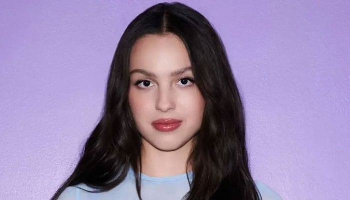 Why Olivia Rodrigo loves writing sad songs?