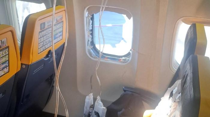 Ryanair passenger's wife recalls terrifying moment she stopped husband being sucked from plane