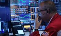 Global stock markets fall as AI chip stocks slide and oil rises