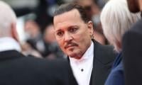 Johnny Depp unveils new look as Scrooge for upcoming film