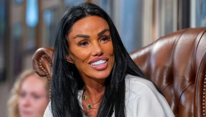 Katie Price puts on a strong face during show while husband spends jail time